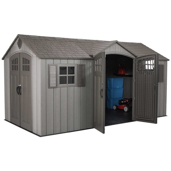 dalinex-product-50-image-1 A gray Lifetime 15′ x 8′ Shed (Side Entry) with double doors, one open to show stacked blue bins, a red gas can, and a small red lawnmower inside. The shed has a shingled roof and a side window.